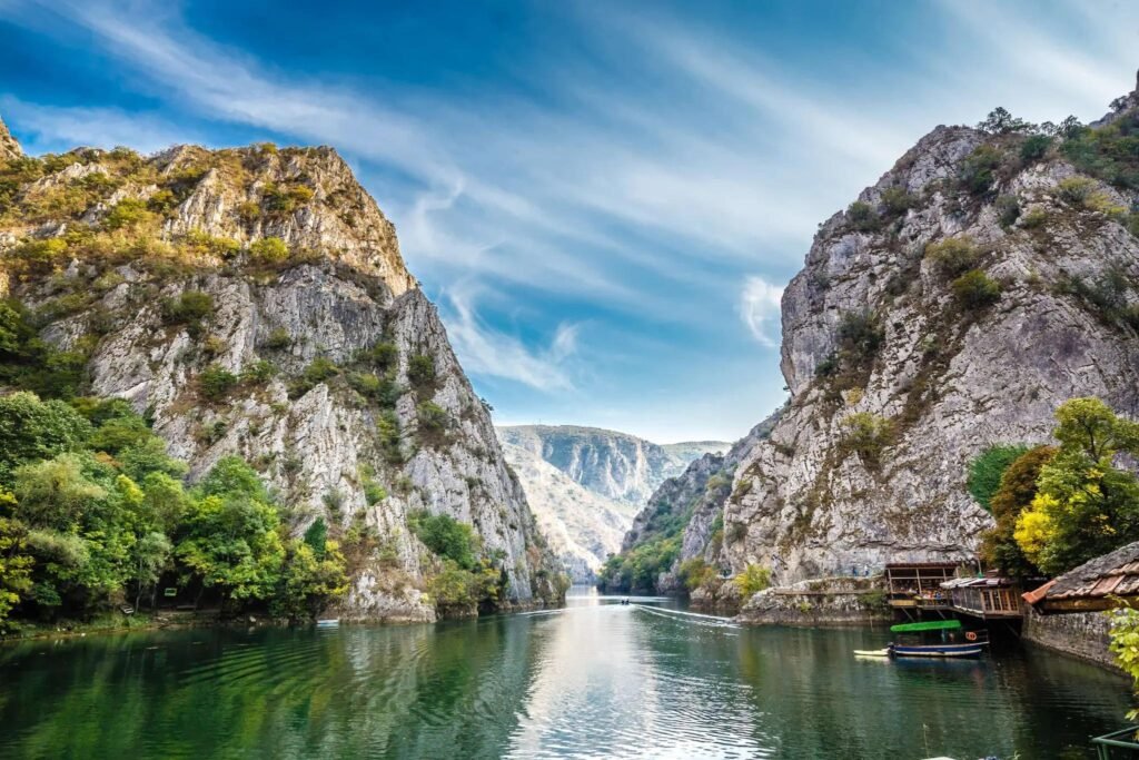 Matka Canyon in North Macedonia with green water and surrounding limestone cliffs